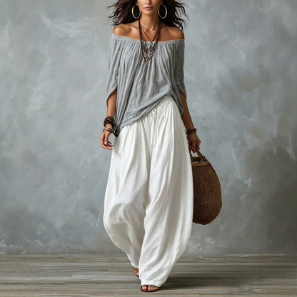 Conjunto blusa blanca hombros descubiertos y pantal�n palazzo negro