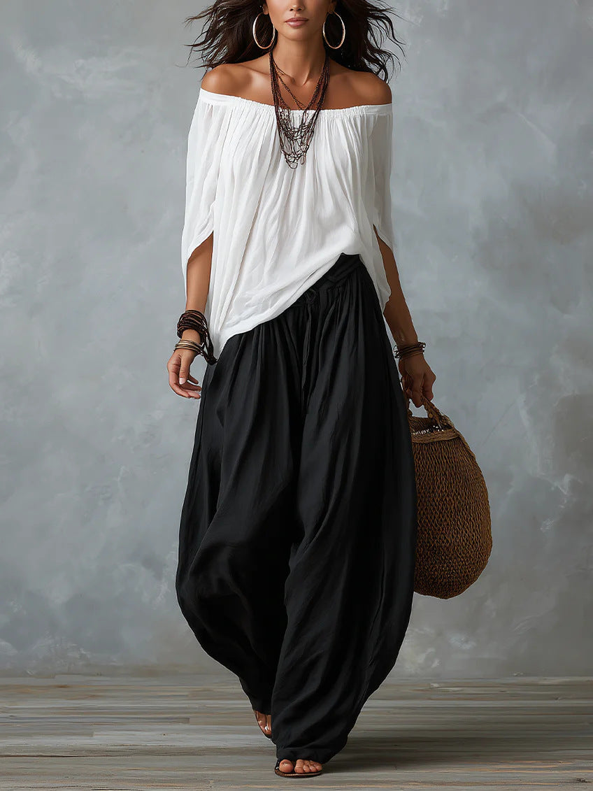 Conjunto blusa blanca hombros descubiertos y pantal�n palazzo negro